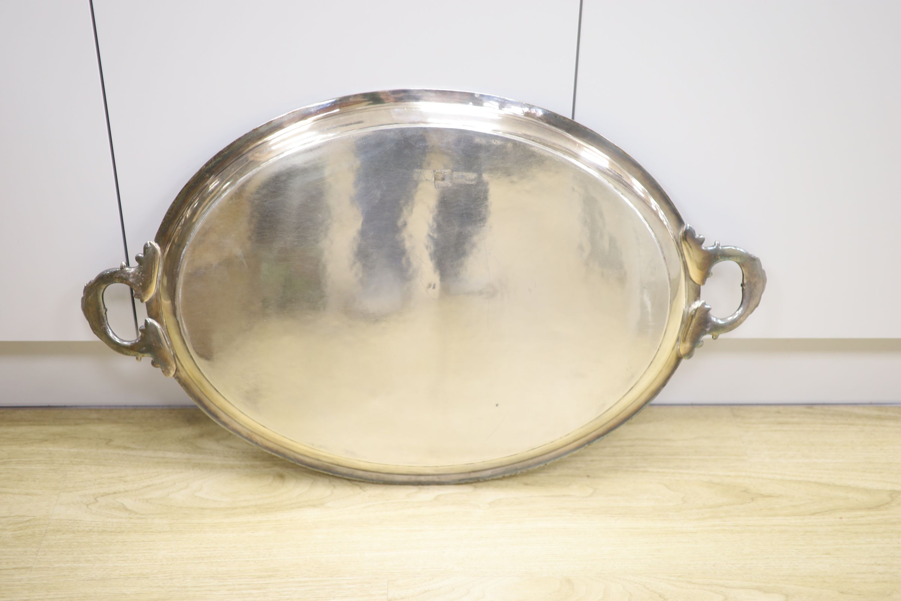 A Victorian silver plated oval two handled tea tray, 78cm.